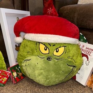 Festive Green Grinch Pillow with Red Santa Hat